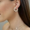 Orb-inspired pearl earrings with clean contemporary lines