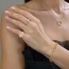 Delicate pinky ring with a round channel-set accent