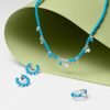 Distinctive revolve earrings with vivid turquoise and clean round form