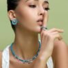 Revolve earrings with premium CZ diamond stones and turquoise accent