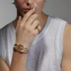 Gold-plated ring with sculptural interwoven triple-band design