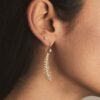 Sterling silver earrings featuring CZ diamond feather detailing