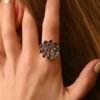 Bezel-set cluster ring with tanzanite stones and CZ diamond detail
