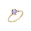 Promise ring featuring prong-set tanzanite and diamond accents