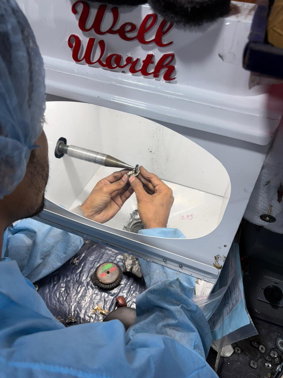 Jewellery artisan working under magnification