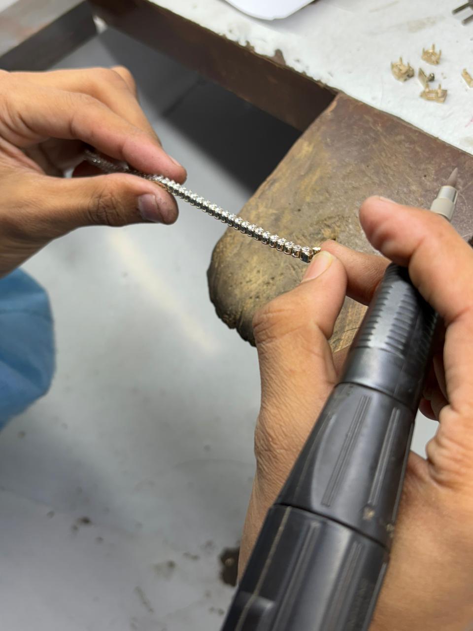 Close-up of jewellery being refined during manufacturing